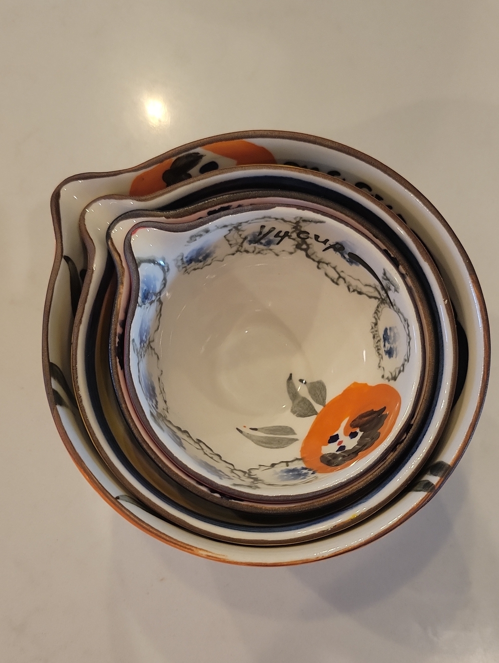 Anthropologie Hand-Painted Ceramic Nesting Bowls — Orange, Cream, Blue